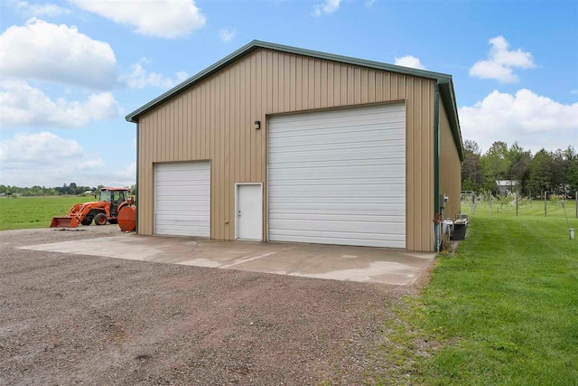 garage featuring a yard