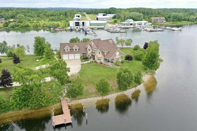 1439 Lindburgh Ln, Cheboygan, MI 49721 - aerial view of property and surrounding area with a large body of water and a heavily wooded area