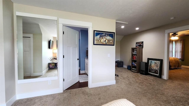 interior space featuring ceiling fan and lofted ceiling