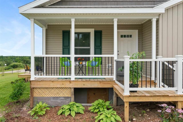 view of exterior entry featuring a porch