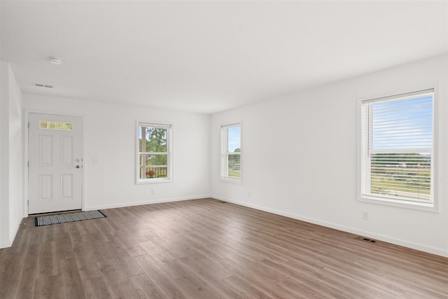 unfurnished living room featuring hardwood / wood-style floors