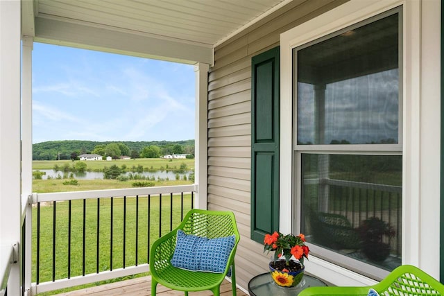 balcony featuring a water view