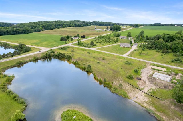 birds eye view of property with a water view and a rural view