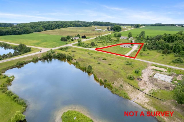 drone / aerial view with a rural view and a water view