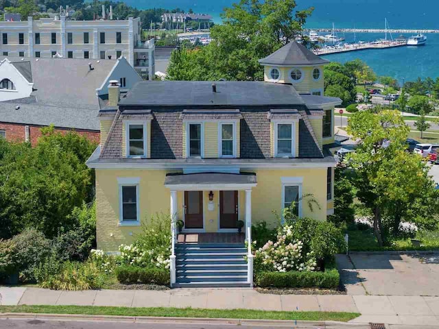 view of front facade with a water view