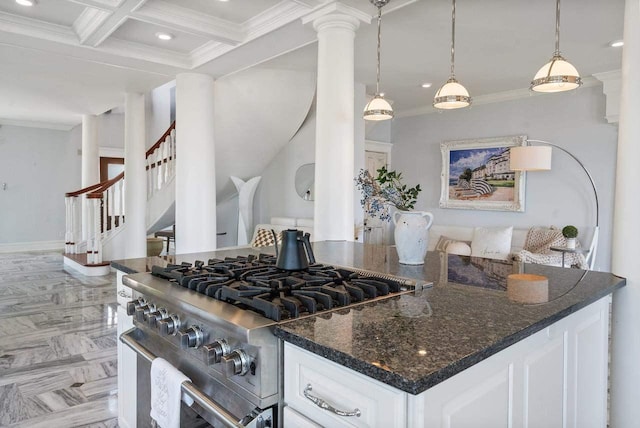 kitchen with hanging light fixtures, coffered ceiling, white cabinets, beamed ceiling, and high end range