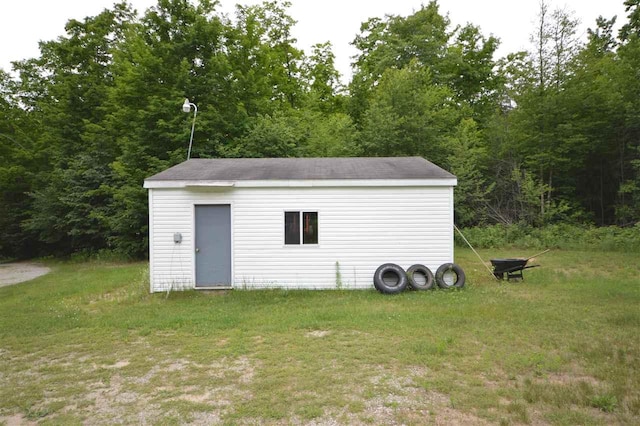 view of outdoor structure with a lawn