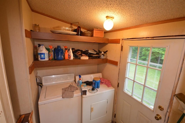 washroom featuring independent washer and dryer and a textured ceiling