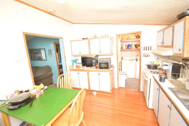 kitchen with a textured ceiling, extractor fan, light hardwood / wood-style flooring, white cabinets, and white range with gas stovetop