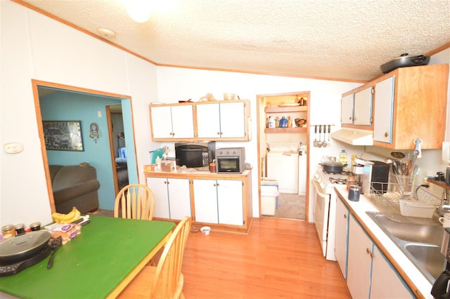 kitchen with white cabinets, light wood-type flooring, a textured ceiling, range hood, and white range with gas stovetop