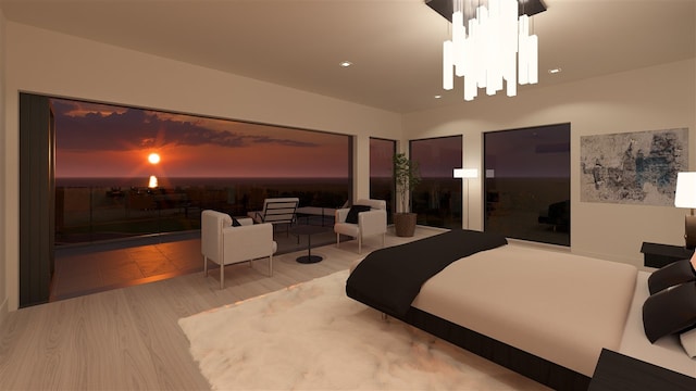 bedroom with hardwood / wood-style floors and a chandelier