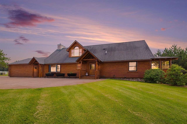 view of front of house with a yard