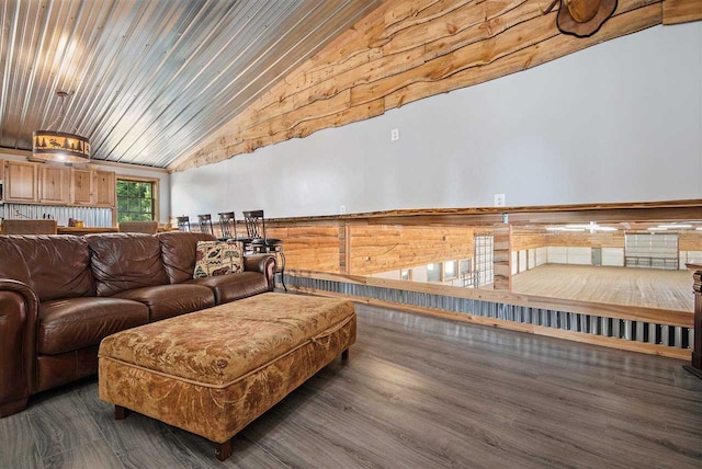 living room featuring lofted ceiling and dark hardwood / wood-style floors