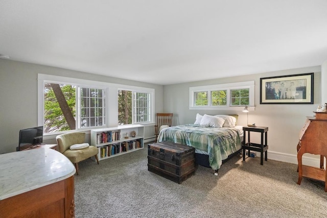 carpeted bedroom with baseboard heating