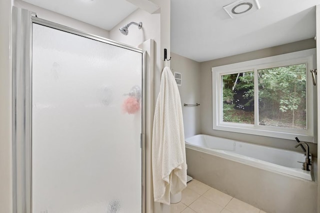 bathroom featuring tile patterned flooring and independent shower and bath