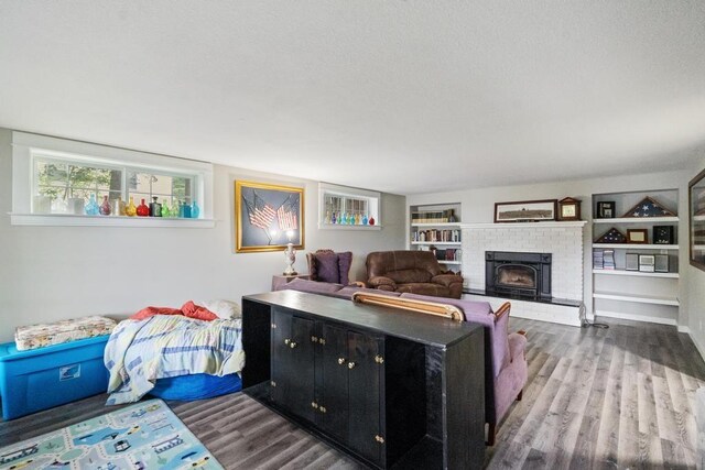 living room featuring hardwood / wood-style floors and a fireplace