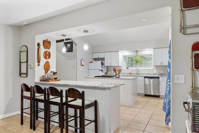 kitchen with dishwasher, white cabinets, a kitchen bar, hanging light fixtures, and white fridge