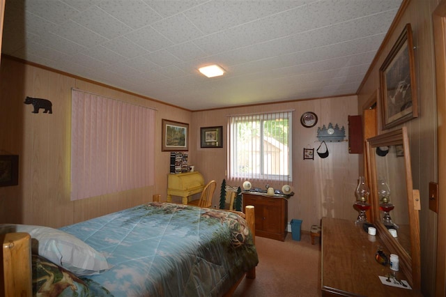 carpeted bedroom with ornamental molding