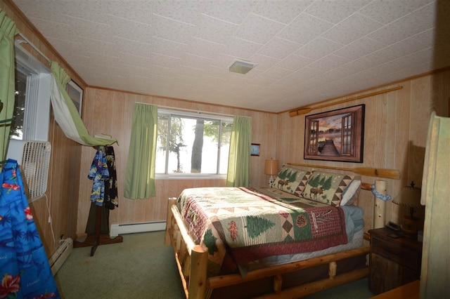 carpeted bedroom with wooden walls and baseboard heating