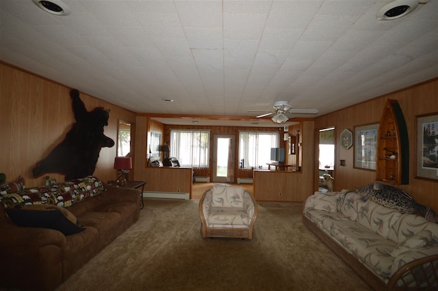 living room with light colored carpet, wooden walls, and ceiling fan