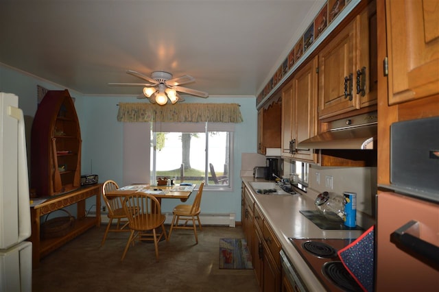 kitchen with white fridge, a baseboard heating unit, ceiling fan, sink, and ornamental molding