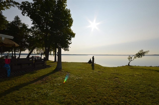 yard at dusk with a water view