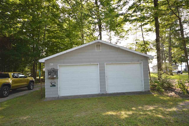 garage with a yard