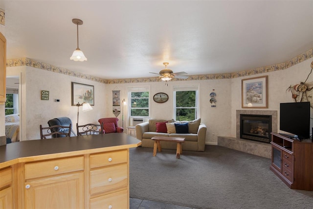 living room featuring carpet and ceiling fan