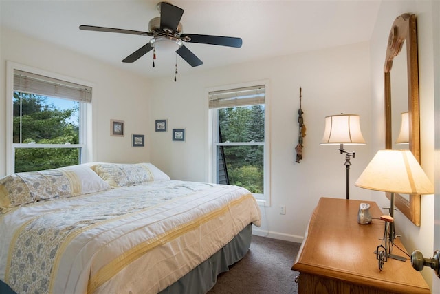 bedroom featuring carpet floors, multiple windows, and ceiling fan