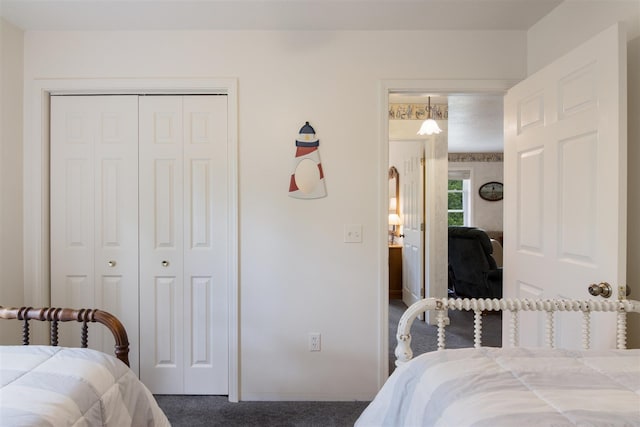 bedroom with a closet and carpet floors