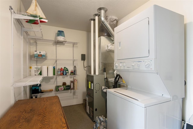 laundry room featuring stacked washer / drying machine and carpet floors