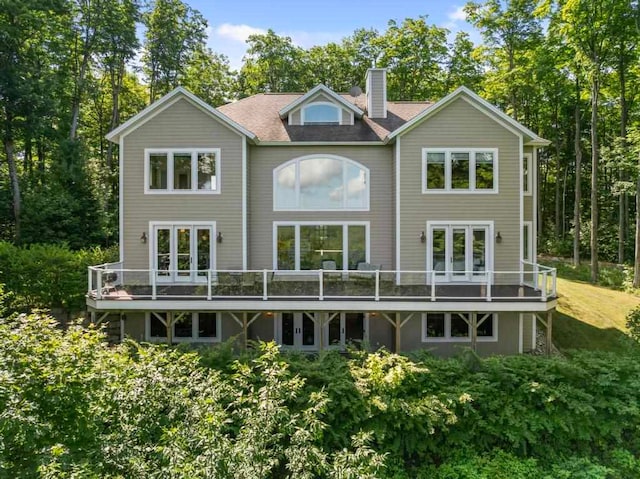 back of property with a wooden deck