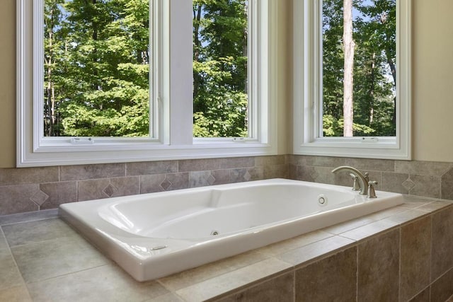 full bathroom with a relaxing tiled tub