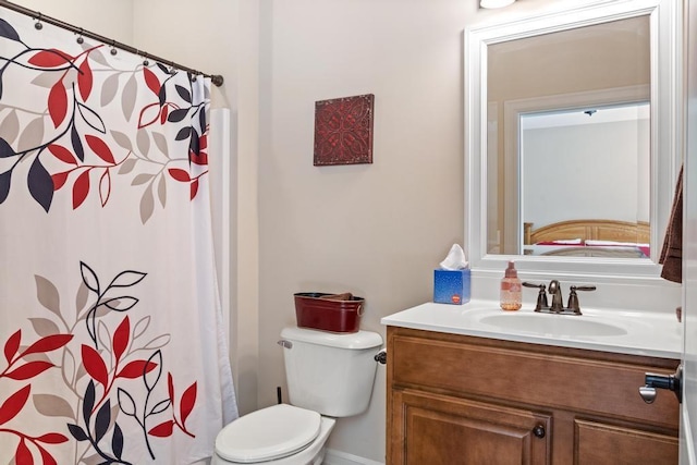 bathroom featuring toilet and vanity