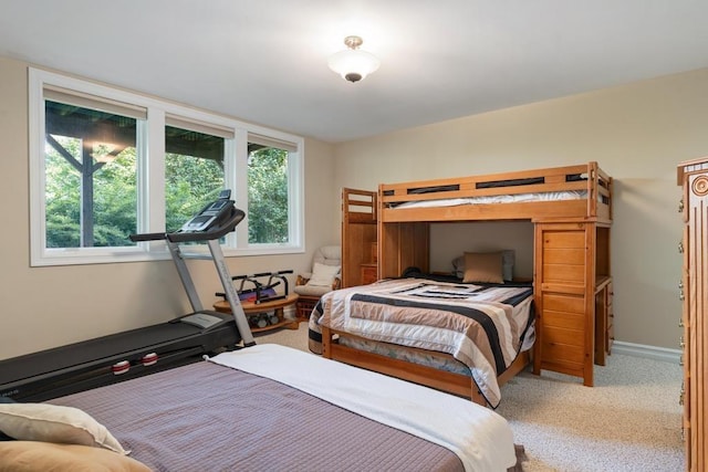 bedroom with carpet and baseboards