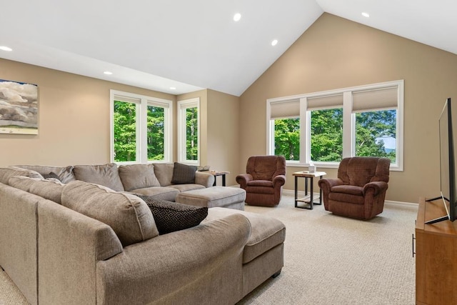 living area featuring baseboards, high vaulted ceiling, recessed lighting, and light colored carpet