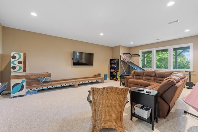 living room with carpet flooring, visible vents, and recessed lighting