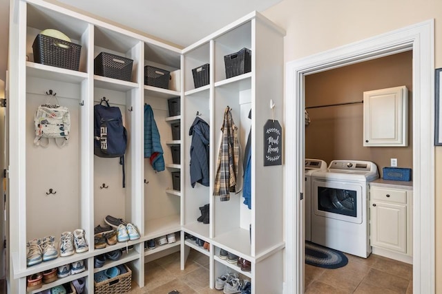 mudroom featuring tile patterned flooring and independent washer and dryer