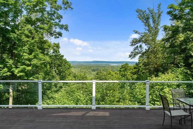 wooden terrace with a forest view