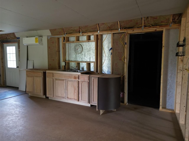 basement featuring a wall mounted air conditioner and sink