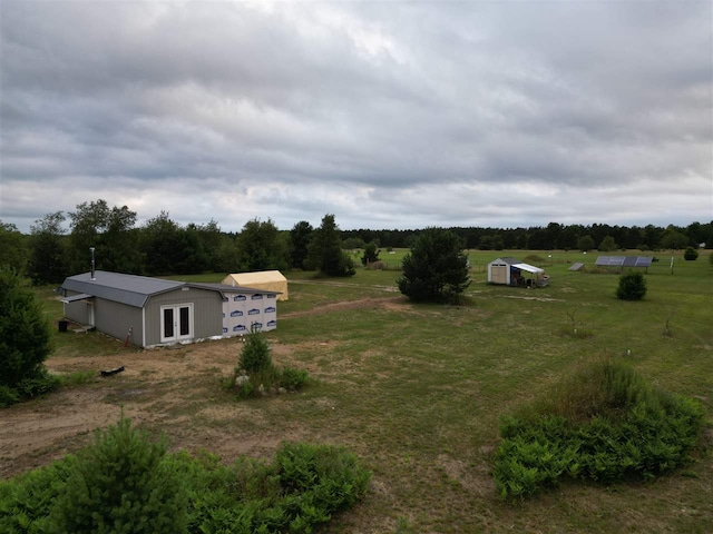 view of yard with a rural view