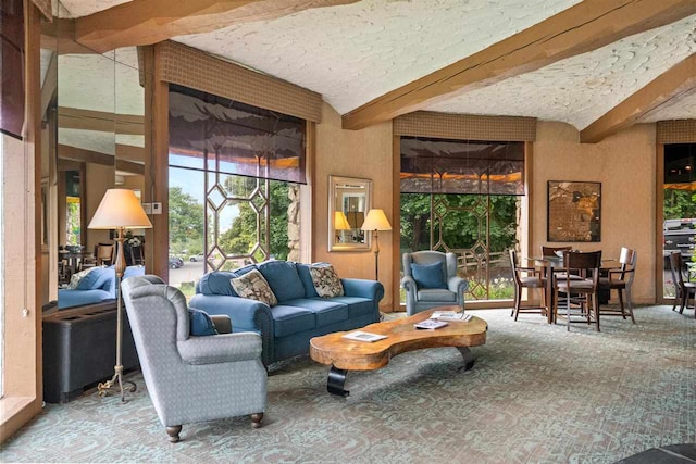 interior space featuring beamed ceiling and a textured ceiling