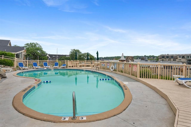 view of pool with a wooden deck