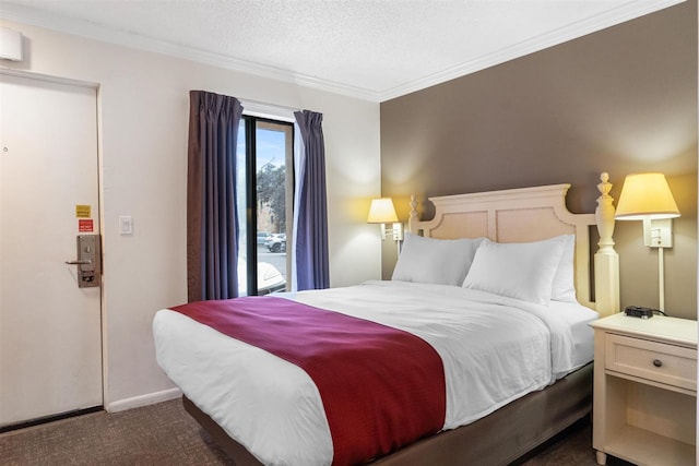 bedroom featuring a textured ceiling, ornamental molding, and dark colored carpet