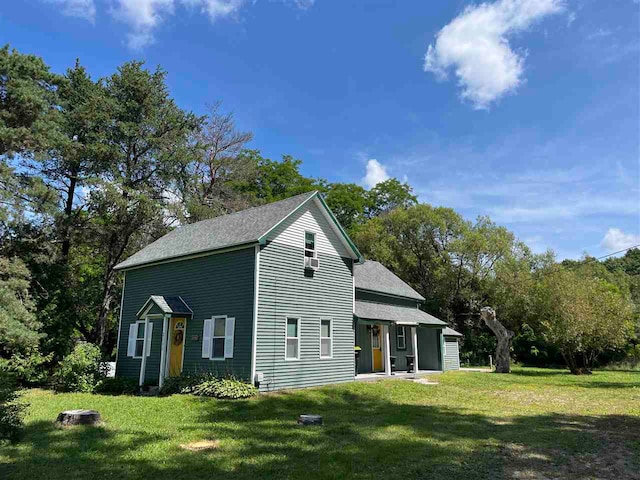 view of property exterior featuring a lawn