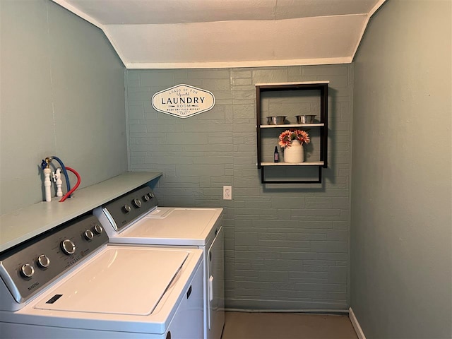 clothes washing area featuring separate washer and dryer and built in features