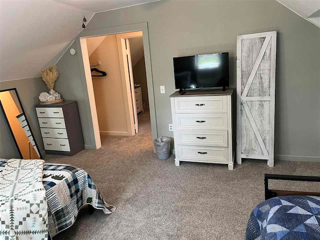 bedroom with carpet and lofted ceiling