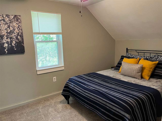 bedroom with carpet and lofted ceiling