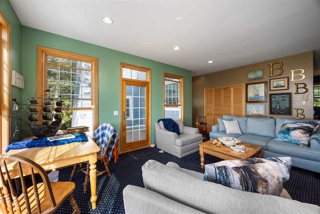 carpeted living area with recessed lighting