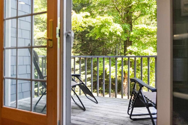 doorway to outside with wood-type flooring